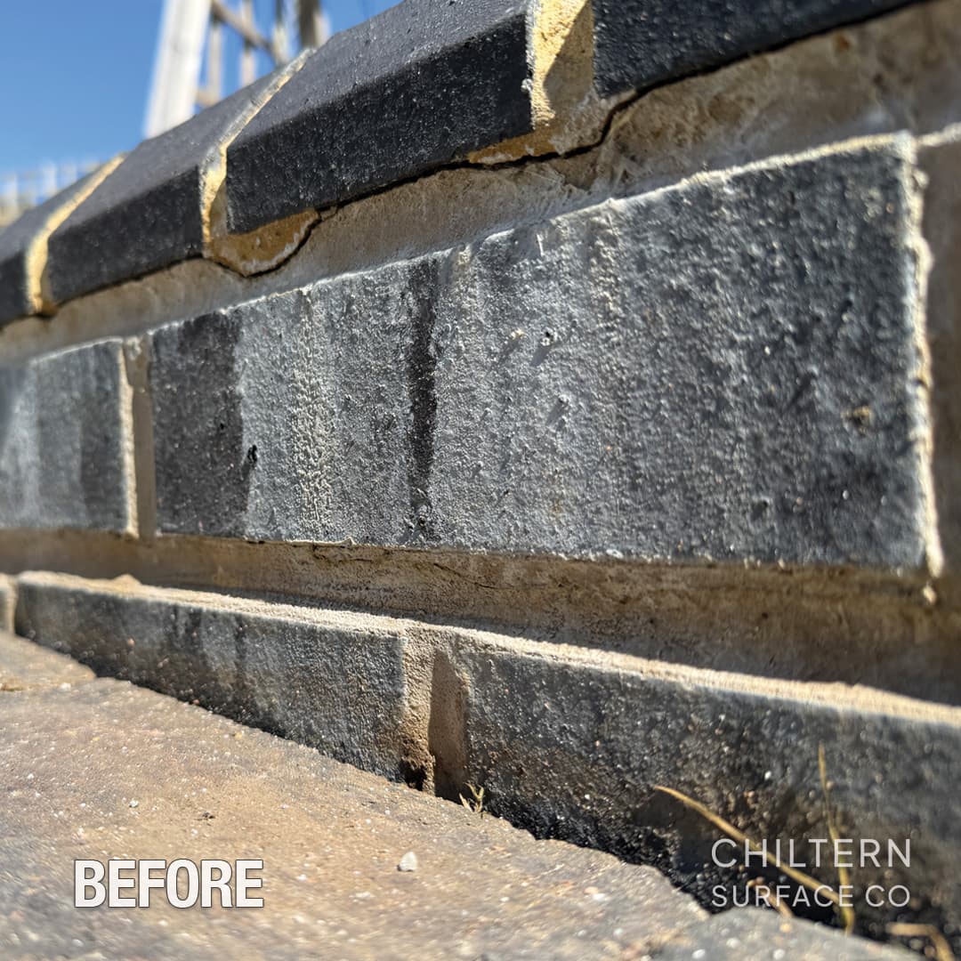 Brick exterior showing efflorescence and organic staining before soft washing